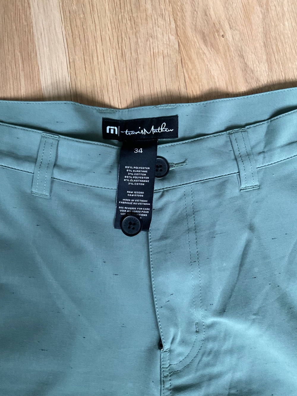 TravisMathew green shorts with marled/flecks material- 34